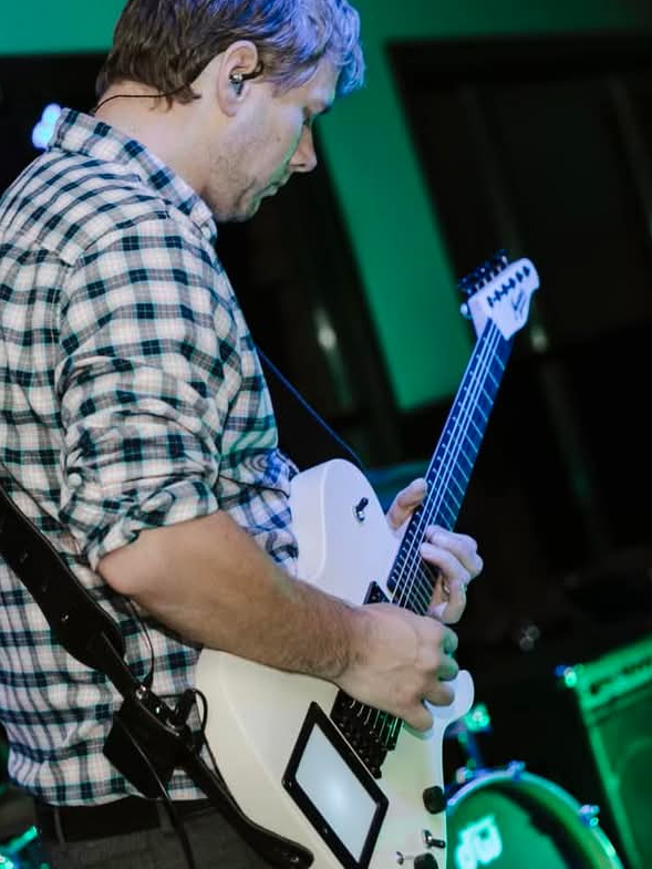 Image of musician Bob Allen playing electric guitar.